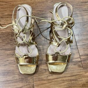 Shiny gold strap up 2” heels